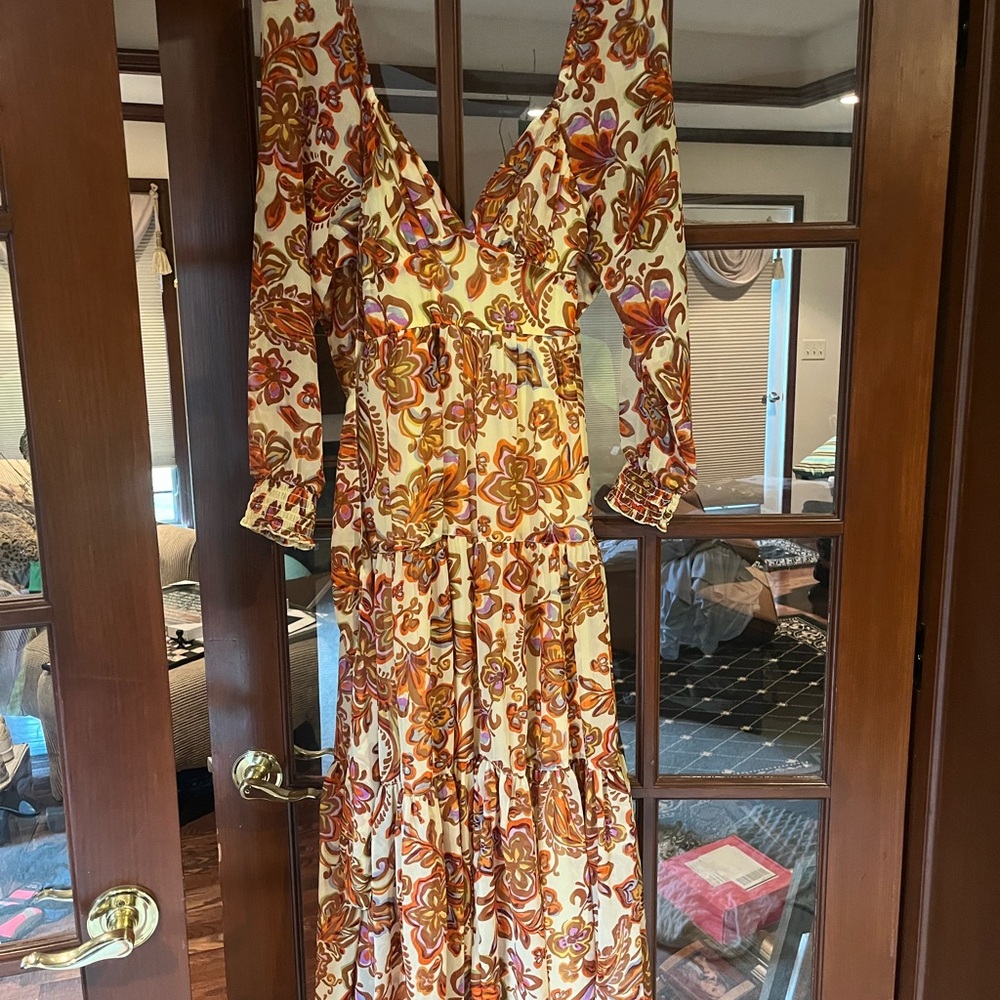 Multicolored dress with sheer sleeves.